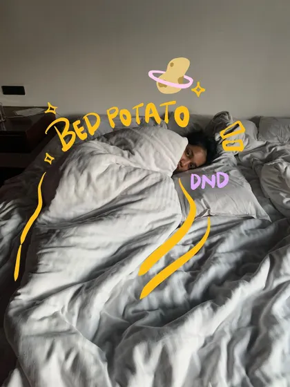 A bed potato in my natural habitat. The doodles add a fun, cosmic vibe to this lazy moment.