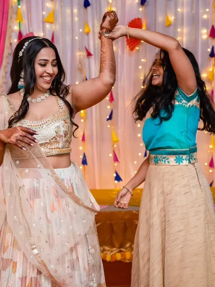 The bride and our anchor share a dance, both with huge smiles. These are the moments of connection and shared joy that we cherish.