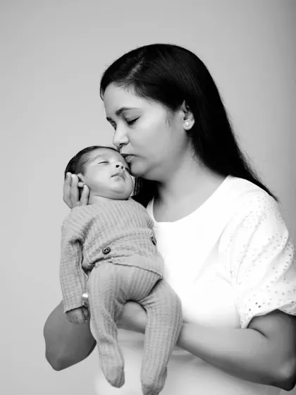 A mother holding her child is a picture of incredible blessing. This simple, elegant black and white portrait focuses on the quiet connection and love.