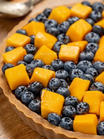 My Signature Chocolate Pudding Tart gets a seasonal twist with fresh mangoes and blueberries. The rich chocolate pairs beautifully with the sweet and tart fruits.