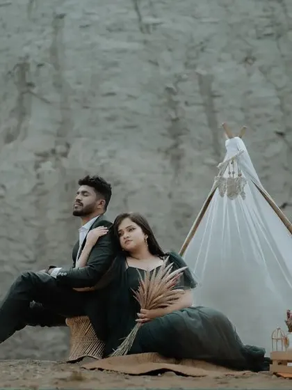 A moody, cinematic pose from a pre-wedding shoot at a quarry. The couple's pose and the dramatic landscape create a powerful and artistic image.
