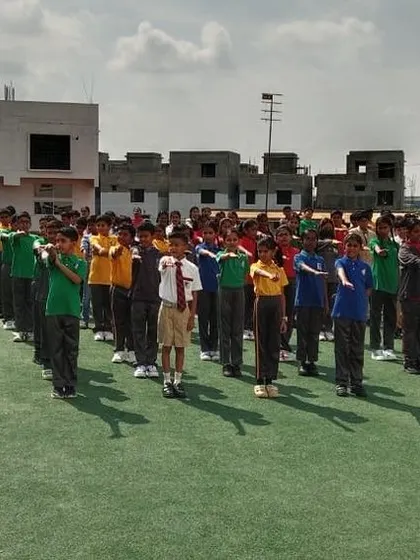 Students take a pledge during the World Environment Day assembly, committing to protect and preserve our planet.