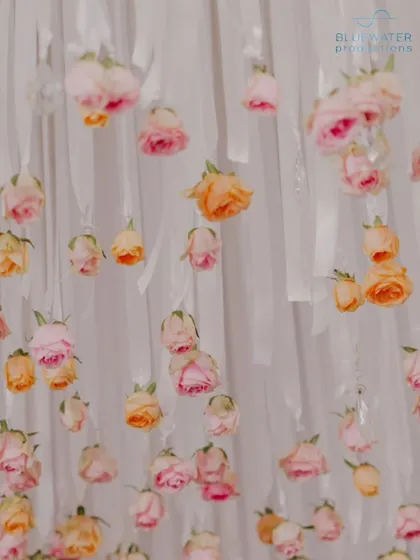 A close-up of the hanging rose decorations used in the reception decor.