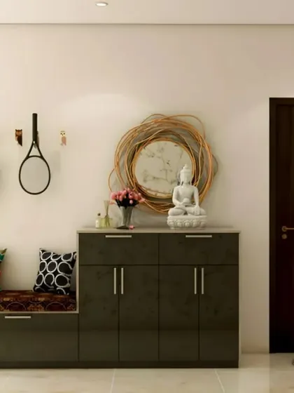 This dark, glossy entryway unit provides a sleek storage solution with an integrated bench. The wall hooks and decorative mirror make it a highly functional space for a busy household.