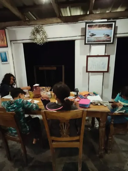 Evenings are for reflection and documentation. Children gather to journal their day's discoveries, reinforcing their learning and creating a personal record of their scientific adventure.