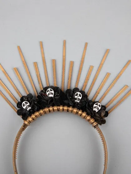 A close-up of the skull details on the sunburst headband.