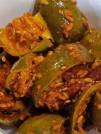 A bowl of my traditional Punjabi mango pickle. This is a classic recipe with whole spices and dried red chilies, giving it a rich and authentic taste. It is made without any preservatives, just like at home.