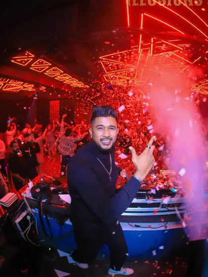 A fisheye lens captures the confetti explosion at Club Illusions. This wide-angle view shows the scale of the celebration from my perspective.
