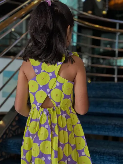 When comfort meets cuteness, you get a wardrobe win. This vibrant lime and purple dress is made for real moments, with no fussy buttons or scratchy fabric.