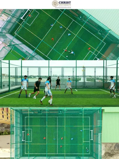 An aerial view of a rooftop football turf at Christ University, demonstrating our ability to capture unique urban campus features and student activities.