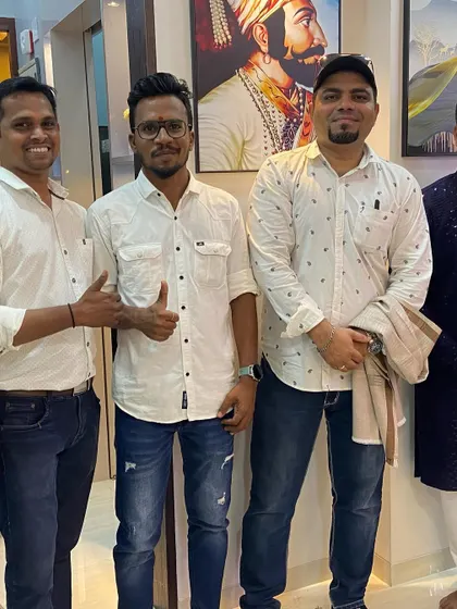 My team and I with the proud homeowner. The portrait of Shivaji Maharaj in the background was a personal touch added to reflect the client's values.