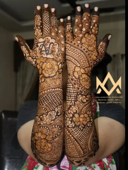 A full view of a floral bridal mehendi, showcasing the detailed work and coverage that makes a bride's hands stand out.