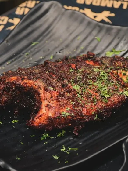 A whole fried fish, marinated in our special blend of spices and cooked to crispy perfection. A real treat for seafood lovers.