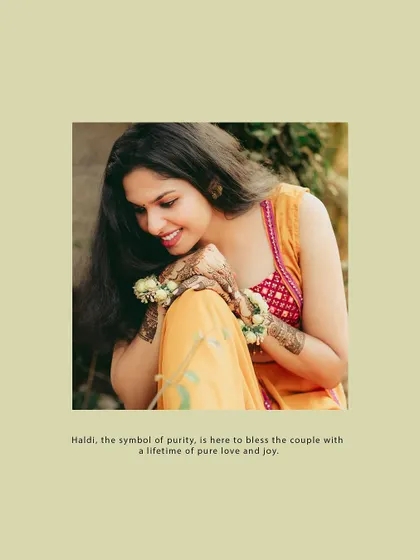 An intimate portrait of the bride looking down at her hands, adorned with mehendi and floral bracelets.