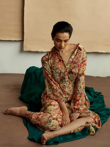 A full-body shot from the same artistic series, showing the entire composition. The pose is gentle and introspective, adding to the quiet mood of the image.