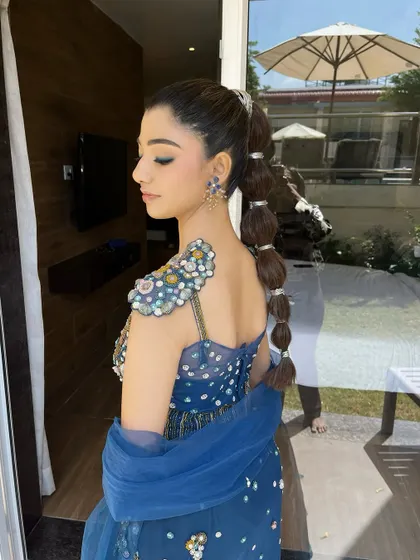 Let's play with themes! This was a fun 'mermaid glam' look for a carnival event. I paired a sharp winged liner and glowing skin with a creative balloon braid to match the whimsical, ocean-inspired fishcut outfit.