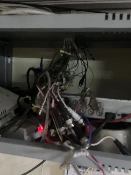 This is what we often find: a tangled mess of wires behind a DVR. This kind of setup is a fire hazard and the main reason for system failures, blurry footage, and recording gaps.