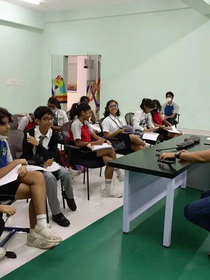 The journey begins with learning. Here, I am conducting a theory session with students from Greenwoods High International School, introducing them to the exciting world of competitive shooting.