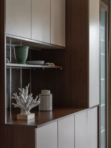 A detail shot of the 'Flux Abode' crockery unit, showing the quality of the finish and the thoughtful styling that completes the look.