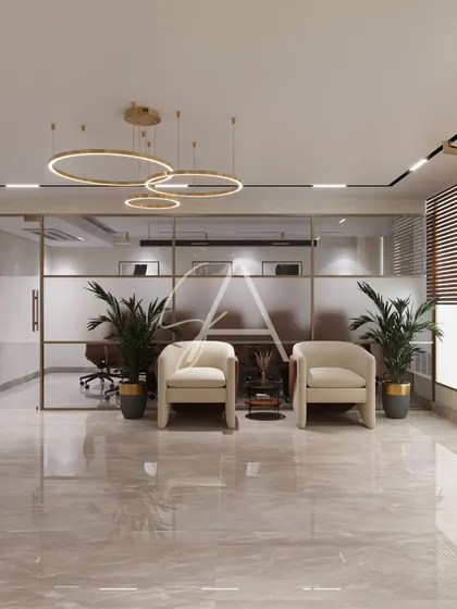 A view from the reception area towards the glass-walled meeting rooms. The frosted glass provides privacy while still allowing light to pass through, maintaining a sense of openness.
