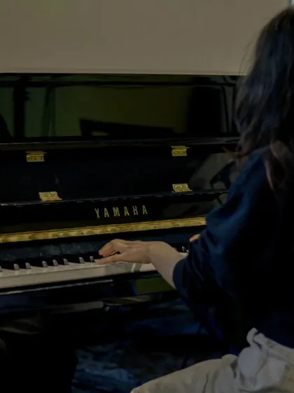 A student finding her flow on our Yamaha piano. The practice that goes on behind the scenes is just as important as the final performance.