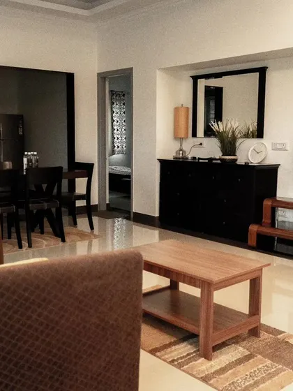 The spacious and modern living room in a private villa, providing a comfortable space for the team to relax together.