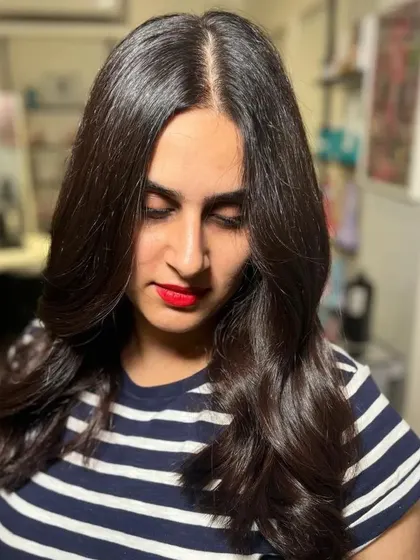 A portrait of the client, her red lipstick perfectly complementing her dark hair.