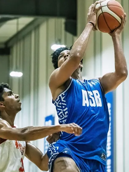 An ASB player going up for a contested layup. Finishing strong at the rim is a skill we drill relentlessly in practice and execute in games.