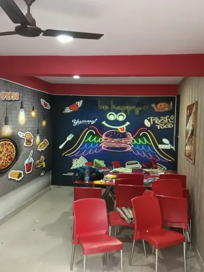 A wider view of the cafe interior, showing how the different murals work together.