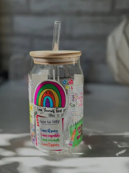 Another view of the affirmation sipper, featuring a "Love Yourself First" message and a cute rainbow.