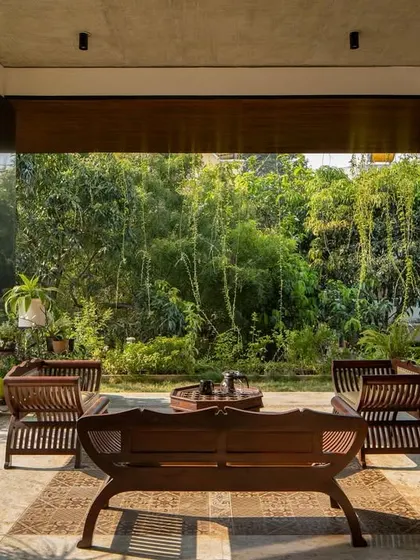 The ground-floor pavilion, a tranquil space that borrows views from the dense greenery of the adjacent property.