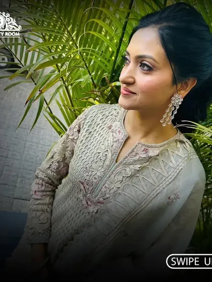 A beautiful outdoor shot of a client. Her makeup is subtle and enhances her features, perfect for a daytime event.