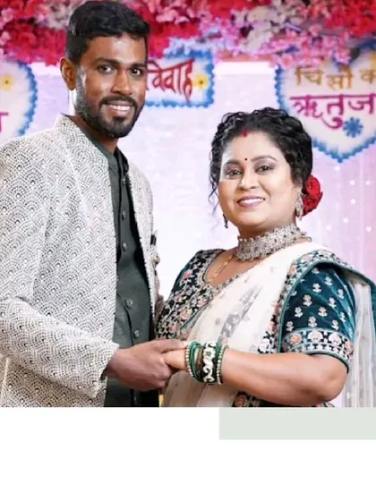 A lovely candid moment between this couple on their wedding day. We helped them coordinate his jacket with her beautiful saree.