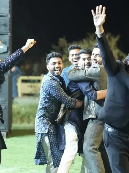 A moment of pure joy and celebration with the groom and his friends. This is the energy I strive to create at every Sangeet I host.