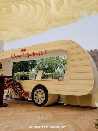 A quirky, custom-designed caravan bar adds a touch of modern fun to the traditional palace setting in Jaipur.