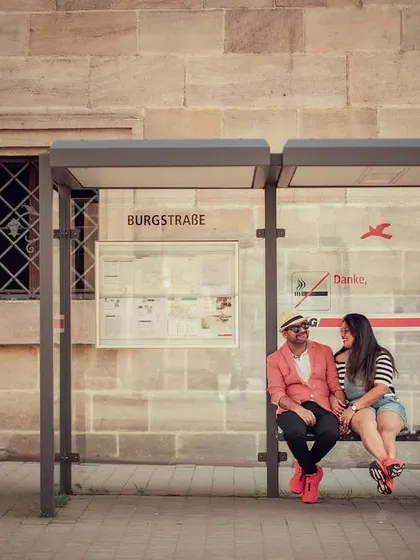 Capturing a quiet moment at a bus stop in Germany. We are available for destination shoots across the globe, turning your travel adventures into beautiful pre-wedding memories.