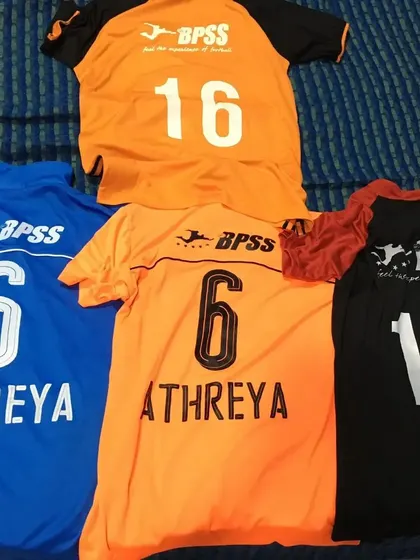 A collection of Athreya's jerseys, marking his journey and growth with BPSS over the years. Each one tells a story of hard work and progress.