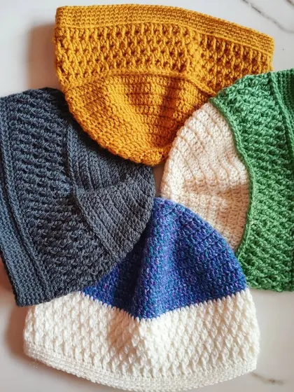 Here is a collection of my Sheldon beanies, all featuring a wonderfully textured Alpine stitch panel. I make these unisex hats in a variety of colors, and they are a warm and stylish handmade accessory for anyone.