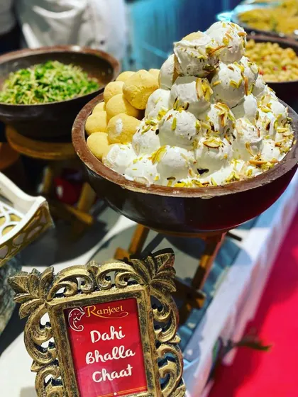 A classic favorite, Dahi Bhalla Chaat, beautifully presented for a festive gathering. We ensure even the most traditional dishes are served with elegance and flair.