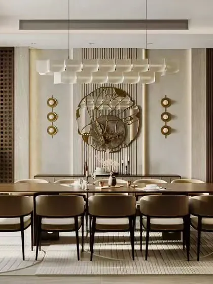 This formal dining room is designed for grand entertaining, with seating for ten. A stunning contemporary chandelier acts as the centerpiece, complemented by intricate wall details and a built-in crockery display cabinet.