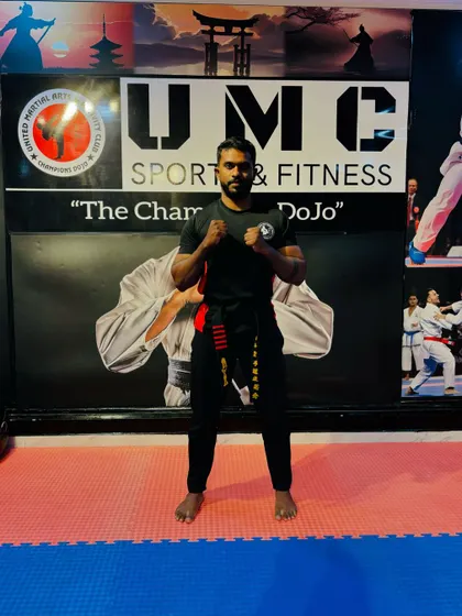 Celebrating progress and dedication. A student is recognized during our Kickboxing Belt Grading Exam, a formal event where members demonstrate their skills to advance in rank.