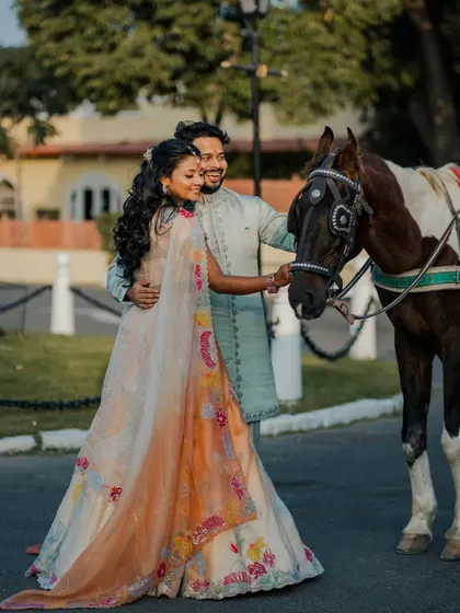 A unique and charming portrait of Radhika and Shivank with a horse at their Roka. This shot adds a touch of royal, rustic charm to their celebration.