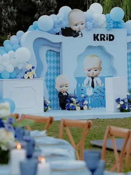 A view of the Boss Baby stage from the guest tables, showing the cohesive blue and white theme throughout the event.