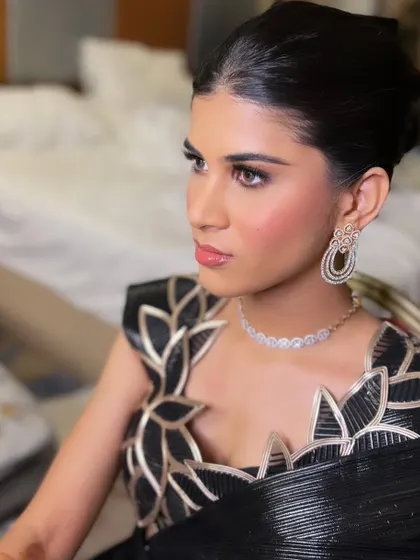 Another beautiful shot of the dewy makeup and glossy lips. The focus is on creating a healthy, radiant glow that looks stunning in any light.