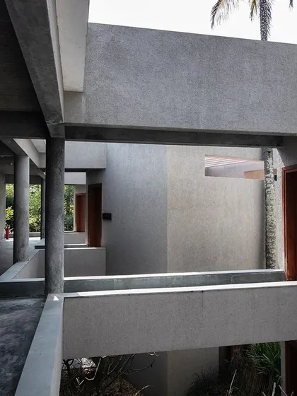 At Anahaspa, a yoga retreat, we created a series of voids and corridors using raw concrete. This creates a monastic, contemplative journey through the space, with framed views of the surrounding nature.