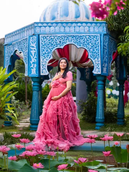 Standing in the lily pond, the mom-to-be looks like a queen in her own water palace. This is a unique and stunning shot we love to create.