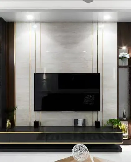 This luxurious entertainment center combines dark wood cabinetry with gold metal inlays and a marble accent wall. Integrated lighting highlights the display shelves and adds a sophisticated glow.