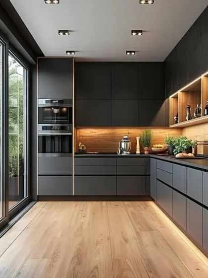 This kitchen showcases a modern, minimalist aesthetic with matte black handleless cabinets and warm wood accents. The layout maximizes space and flow, while strategic under-cabinet and open-shelf lighting adds depth and highlights the clean lines.