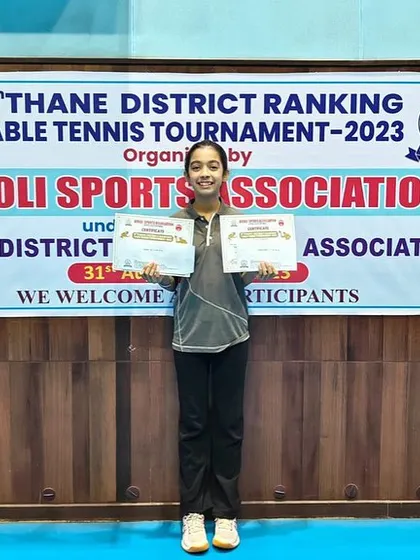 Hrithika Madhur with her certificates after winning a silver and a bronze medal at the 5th District Ranking held at Airoli Sports Association.