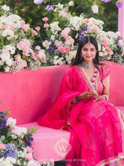 Celebrating one of our own with a vibrant Mehendi on a home terrace. The decor was filled with colorful hanging flowers and lush floral arrangements, creating a joyful setting for lots of dancing and fun.